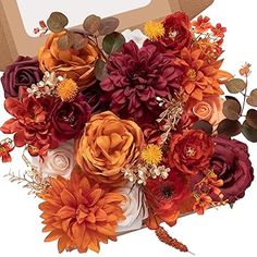 a bouquet of flowers is in front of a card