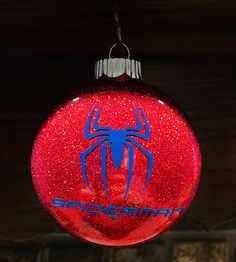 a spiderman ornament hanging from a ceiling