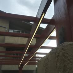 an outside view of a building with red railings