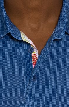 A dense bird's-eye stitch textures this moisture-wicking performance polo finished with an embroidered skull logo at the back. Spread collar Short sleeves Moisture-wicking fabric engineered for dryness and comfort 92% polyester, 8% spandex Machine wash, tumble dry Imported Blue Polo Shirt For Golf, Blue Short Sleeve Polo Shirt With 4-way Stretch, Blue Moisture-wicking Polo Shirt For Golf, Blue Collared Polo Shirt With Moisture-wicking, Blue Moisture-wicking Collared Polo Shirt, Blue Moisture-wicking Polo Shirt With Collar, Blue Moisture-wicking Polo Shirt, Fitted Blue Polo Shirt For Sports, Embroidered Skull