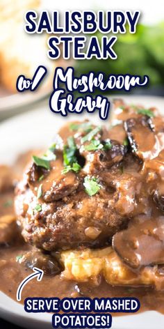 salisbury steak with mushroom gravy served over mashed potatoes on a white plate