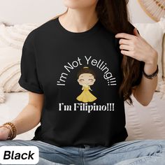 DESCRIPTION Do you have a Filipino Friend or Family member that speaks way too loud? This trendy shirt plays on the stereotype of Filipinos being perceived as loud. Get your friend this gag gift today!This Asian culture dish is an American Favorite. Gift your Filipino Friend this shirt today! OTHER LISTINGS YOUR MIGHT LOVE https://luxuriousgiftsndecor.etsy.com/listing/1655107432/filipino-funny-t-shirt-funny-trendy https://luxuriousgiftsndecor.etsy.com/listing/1671868865/funny-filipino-t-shirt-gi Funny Black Tops With Character Print, Funny Character Print Tops For Fan Merchandise, Funny Fan Merchandise Tops With Character Print, Funny Character Print Tops For Fans, Funny Black Shirt For Fan Merchandise, Funny Text Tops For Fan Merchandise, Black Tops With Funny Text For Fans, Black Tops With Funny Text For Fan Merchandise, Filipino Pop Culture