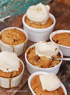 several desserts in small white dishes with ice cream on top