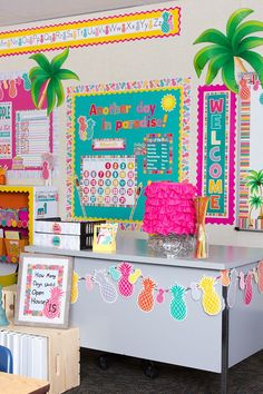 this classroom is decorated with pineapples, palm trees and other colorful things on the wall