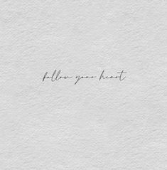 the words follow your heart written in cursive handwriting on a white paper background