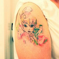 a woman with a tattoo on her arm that has an image of snow white and blue eyes