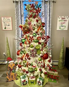 a decorated christmas tree in the corner of a room