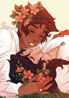 a man and woman hugging each other with flowers in their hair on top of them