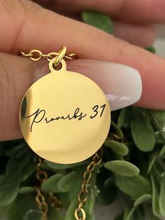 A beautiful 18k gold plated 18" disc necklace engraved with Proverbs 31 on one side and "A woman who fears the Lord is to be praised" on the other side. Charms are gold plated over stainless steel. Plated jewelry is a wonderful, affordable way to add a sophisticated look to your wardrobe, with the look of real gold. It is also an excellent choice for people with sensitive skin. CARE TIPS: Avoid contact with perfumes, body oils, and other chemicals, including household cleaners. Never use chemica Gold Promise Jewelry With Birth Flower, Inspirational Nickel-free Gold Necklace, Inspirational Gold Round Pendant Jewelry, Womens Retreat Gifts, Proverbs Woman, Bible Verse Necklace, Retreat Gifts, Women's Retreat, Gold Disc Necklace