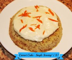 carrot cake with white frosting and orange fish on top