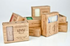 several wooden boxes are stacked on top of each other, with labels in the middle