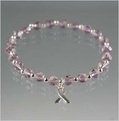 This bracelet was made to bring awareness of Alzheimer's Disease. It is made with light amethyst Swarovski Crystal and sterling silver beads and awareness charm.This bracelet is made with stretch material with a length of 7 inches (before closing the bracelet) but you can select a size from the available options if you need another size. You can also add a clasp instead of using the stretch material for an additional charge. PERSONALIZE YOUR BRACELET! We can add a personalized engraved flat hear Lymphoma Awareness, Handcrafted Beaded Jewelry, Awareness Jewelry, Faith Jewelry, Awareness Bracelet, Light Amethyst, Awareness Ribbon, Awareness Ribbons, Art Gifts