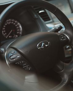 the steering wheel and dashboard of a car