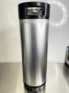 a stainless steel blender sitting on top of a counter