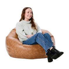 a woman sitting on a bean bag chair