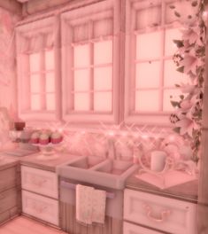 a pink kitchen with cupcakes on the counter