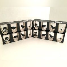 six cups with black and white designs on them