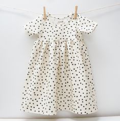 CHICKADEE Babydoll dress DOTTIE dots on cream No buttons, no zippers, no snaps! Just easy, comfy cotton jersey. Short sleeves available. I am very open to custom orders or different fabric combos!  The prints are designed exclusively for WillbirdBaby. *Please note that pattern placement may vary from piece to piece. - Handmade in Canada - Dresses are machine washable, but hang dry if possible. ;) The sizes are just a guideline. The fit of the dresses allows you to wear them loose or fitted. Plea Polka Dot Cotton Playtime Dress, Cute Polka Dot Cotton Dress, Polka Dot Dresses With Buttons And Short Sleeves, Minky Fabric, Toddler Kids, Black Polka Dot, Babydoll Dress, Etsy Fashion, Different Fabrics