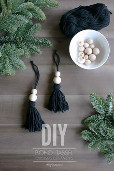 some beads are in a white bowl on a wooden table next to plants and a black bag