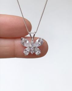 Sterling Silver Clear CZ Butterfly Necklace Metal: All components are made from solid .925 Sterling Silver Stone: Cubic Zirconia Measurement: pendant height is 18mm including bail and 17mm wide Choose Chain Length At Checkout You can find other CZ and Birthstone Jewelry in my shop here https://www.etsy.com/shop/LinksAndStones?ref=seller-platform-mcnav&section_id=24399452 Please feel free to Convo me with any questions before purchasing. Please view policy before purchasing Thank You For Visi Silver Pendant Jewelry With Brilliant Cut, Silver Crystal Necklace With Prong Setting, Silver Sterling Silver Necklaces With Prong Setting, Sterling Silver Necklace With Prong Setting, Silver Sterling Necklace With Prong Setting, Silver Sterling Silver Necklace With Prong Setting, Silver Crystal Flower Pendant Jewelry, White Flower Pendant Jewelry With Prong Setting, Dazzling Silver Flower Pendant Jewelry