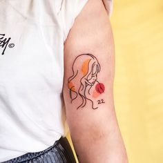 a woman's arm with a tattoo on it that has a lady holding a flower