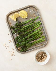 asparagus and lemon slices on a tray