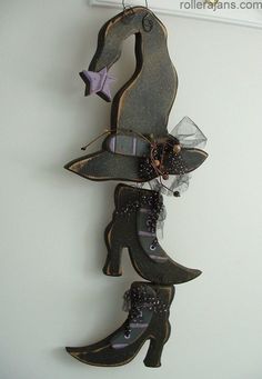 a pair of shoes hanging from the side of a wall