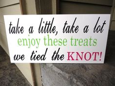 a sign that says take a little, take a lot enjoy these treats we tried the knot