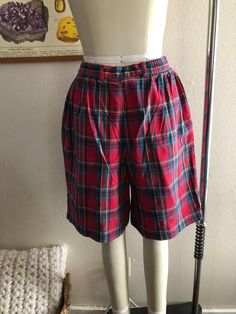 Vintage high rise plaid shorts, good condition, women's size 12 runs smaller. Shown here on a women's size 4 mannequin. Please use measurements for reference as vintage sizes vary. Measurements laying flat, not doubled 13.75 inch waist (also has elastic on the back of waistband) 21 inches in length All sales final, thanks for looking :) Plaid High-waisted Cotton Shorts, High-waisted Plaid Bottoms With Built-in Shorts, Vintage Plaid Bottoms For Summer, Plaid High-waisted Fitted Shorts, Fitted Plaid High-waisted Shorts, Vintage Plaid Summer Bottoms, High Waist Plaid Cotton Shorts, Plaid High Waist Cotton Shorts, Fitted Plaid Cotton Shorts