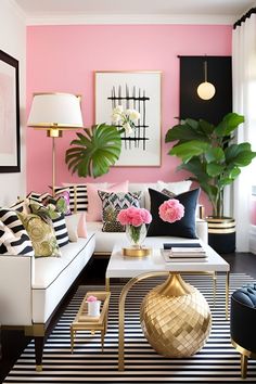 a living room with pink walls, black and white striped rugs and gold accents