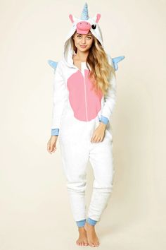 This plush hooded jumpsuit features an embroidered unicorn design on the hoodie, protruding ears, horn, stitched angel wings on the back, a zipper front, long sleeves, and contrast trim. Hooded Pajama, Pajama Jumpsuit, Embroidered Unicorn, Hooded Jumpsuit, Unicorn Life, Unicorn Fashion, Unicorn Outfit, Real Unicorn