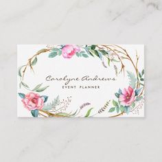 a white business card with pink flowers and greenery on the front reads, caregive andrews event planner