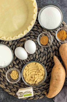 ingredients to make sweet potato pie laid out on a wicker tray