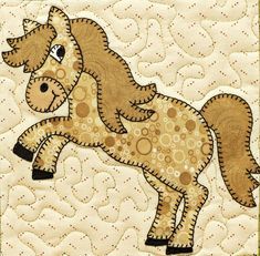 a quilted horse is shown on the wall