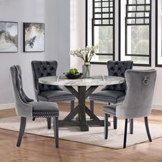 a dining room table with chairs around it