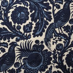 a blue and white fabric with birds on it