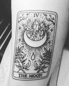 the moon tarot card tattoo on the leg