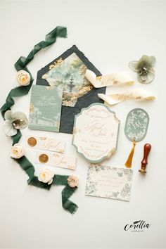 the wedding stationery is laid out on top of each other