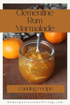 a jar filled with orange marmalade sitting on top of a wooden table