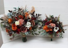 two bouquets of flowers sitting on top of a white bench next to each other