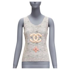 rare CHANEL 04C Vintage CC Byzantine Gripoix applique Camellia lace top FR38 M Reference: TGAS/D00093 Brand: Chanel Designer: Karl Lagerfeld Collection: 04C Material: Cotton, Nylon Color: Cream, Pink Pattern: Lace Closure: Pullover Extra Details: Gathered waistband at the back. Made in: Italy CONDITION: Condition: Very good, this item was pre-owned and is in very good condition. Please refer to image gallery for thorough condition check. Item appears to be in great condition, however there is mi Top In Pizzo, Chanel Designer, Chanel Vintage, Pink Pattern, Issey Miyake, Lace Closure, Image Gallery, Karl Lagerfeld, Neiman Marcus