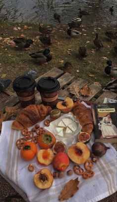 a picnic table with food and drinks on it