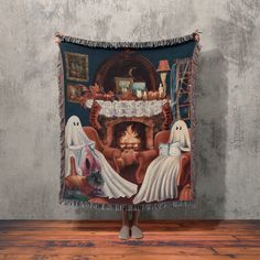 a woman standing in front of a wall hanging tapestry