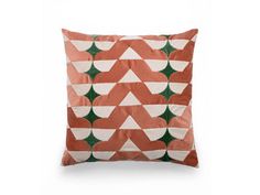 an orange and white pillow with geometric shapes