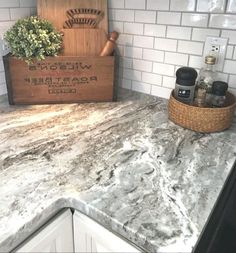 a kitchen counter with a wooden crate on it