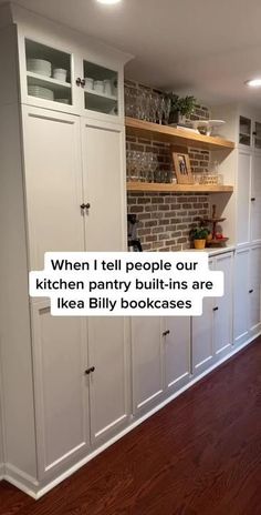 an empty kitchen with white cabinets and wood flooring on the walls is featured in this post