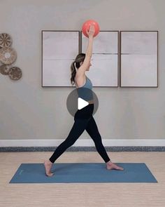 a woman doing yoga with a ball in her hand