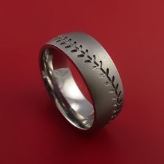 a wedding ring with an engraved design on it