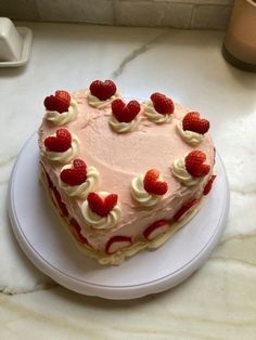 a heart shaped cake on a white plate