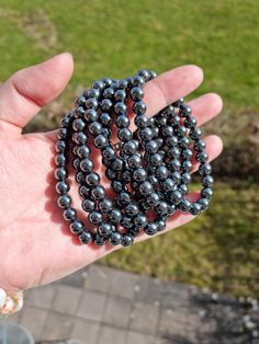 Gorgeous Hematite, round beads. This unisex, stretch fit bracelet is elasticated, allowing for easy on/off fit. Weight - 32,2 grams. Beads - approximately 8 mm. Note:  Because this is a 100% natural crystal the following may apply: The size & weight of everything is always different, it's normal for the difference. The color may also have some difference with the product, it is normal. The pictures often look larger than real product, please refer to the product size provided through pictures and measurements. Hematite Bracelet, Fitness Bracelet, Nature Bracelets, One 1, Natural Crystals, On Off, Round Beads, Sweden, Jewelry Bracelets